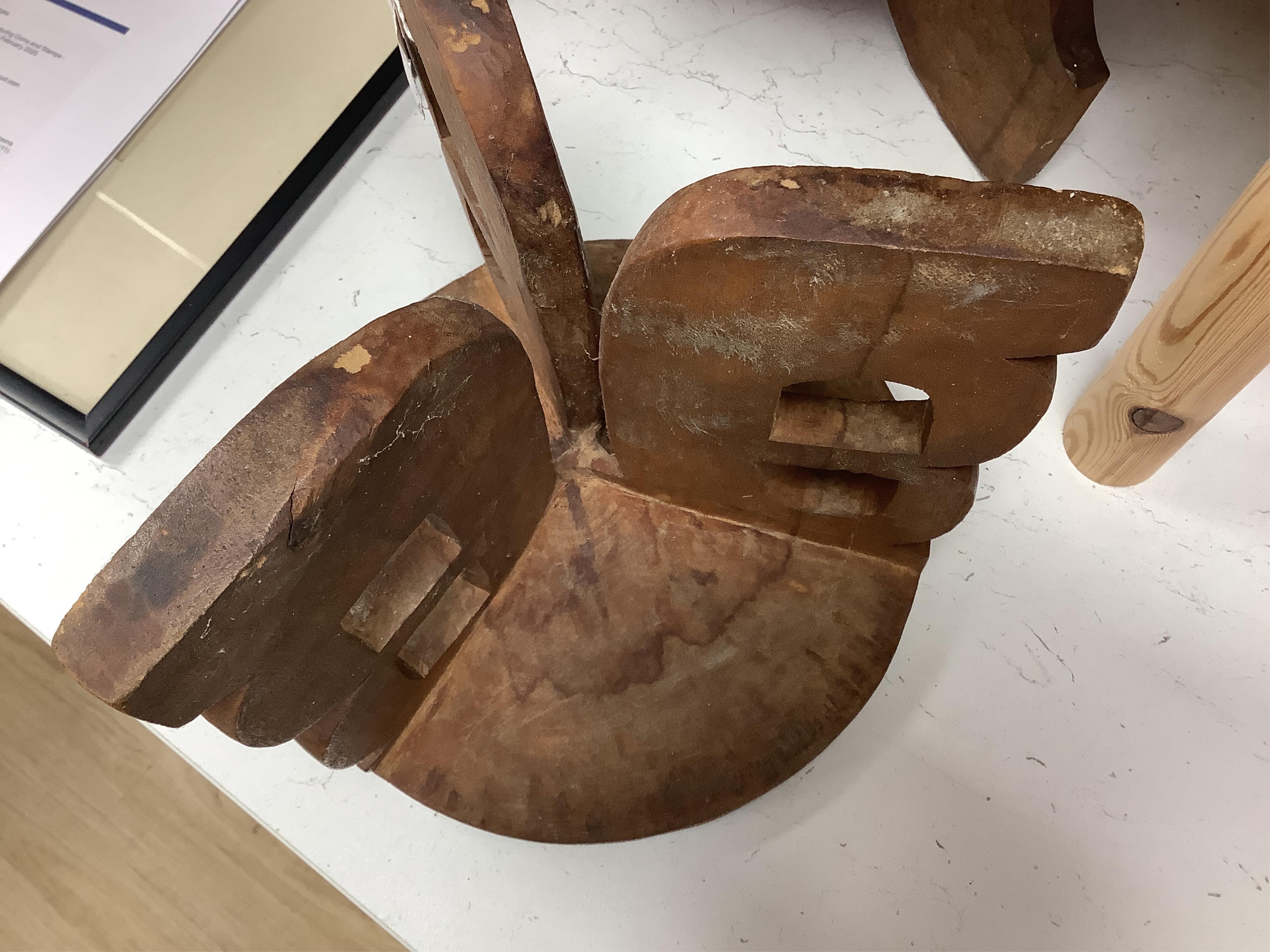 Two African tribal busts, two carved spoons and three carved Kamba Kenyan stools (11). Largest stool 28cm high. Condition - mostly good, some staining to seat of largest stool